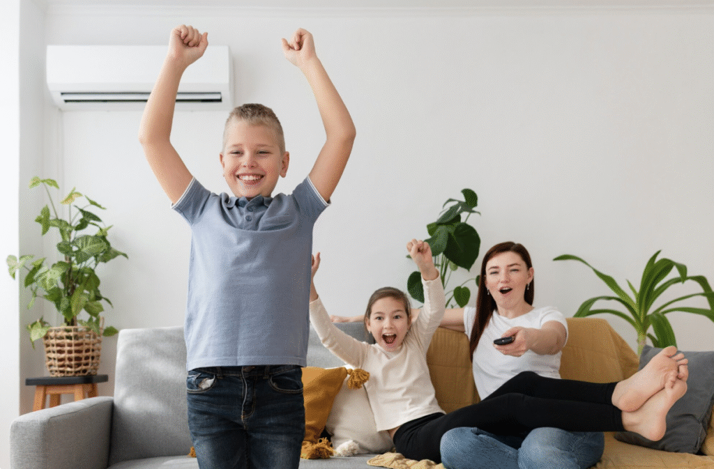 A happy family relaxing in their living room, enjoying a comfortably cool environment provided by an efficient air conditioner.