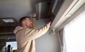 Man inspecting the A/C unit.