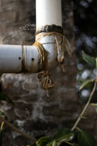 A leaking pipe with water dripping